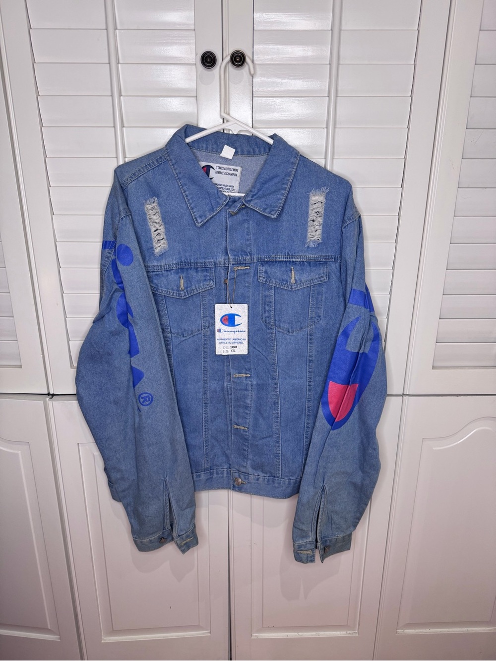 Champion Light Blue Denim Jacket with Blue and Red Sleeve Graphics